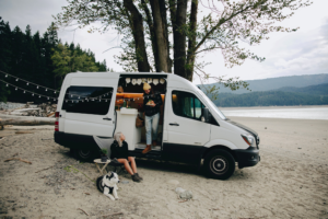 people with a dog living the van life 