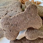 a stack of bone-shaped carob dog treats