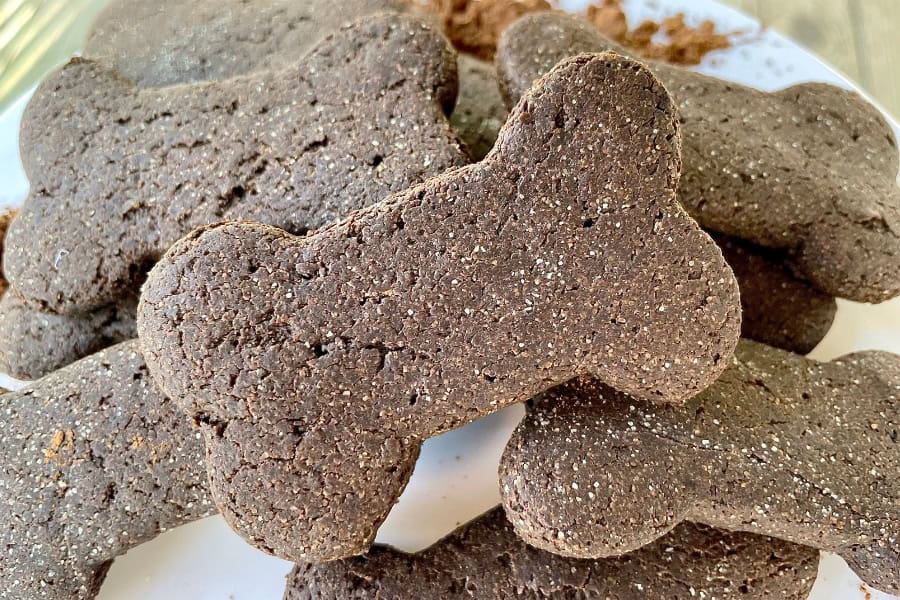 a stack of bone-shaped carob dog treats